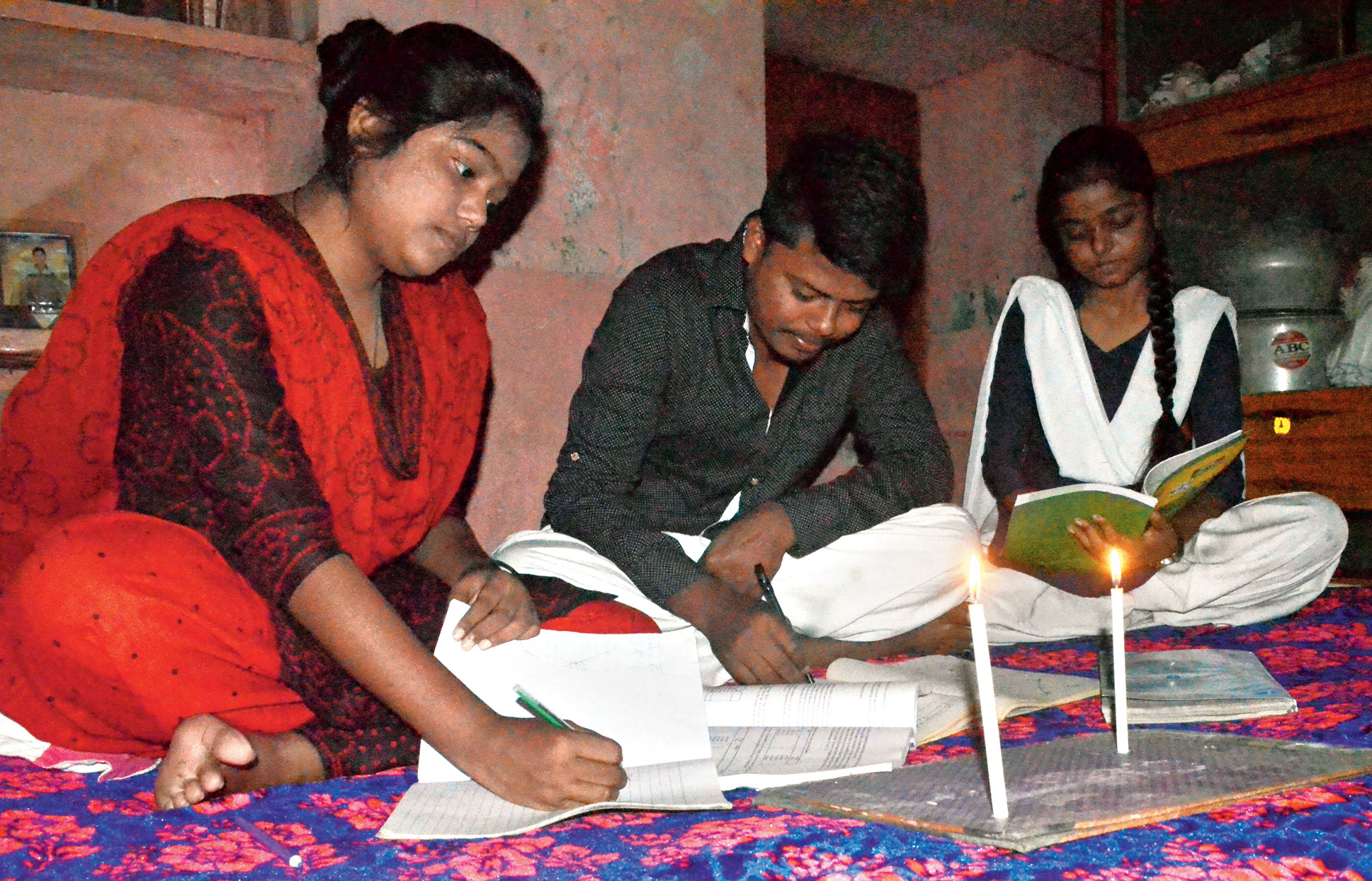 dark days:  Students use candles to study in Jharia, Dhanbad, on Thursday night.