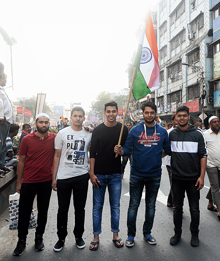 The group of five at the protest rally on Monday afternoon. Mohammed Anasul Haque holds the Tricolour with Mohammed Azim on his left.