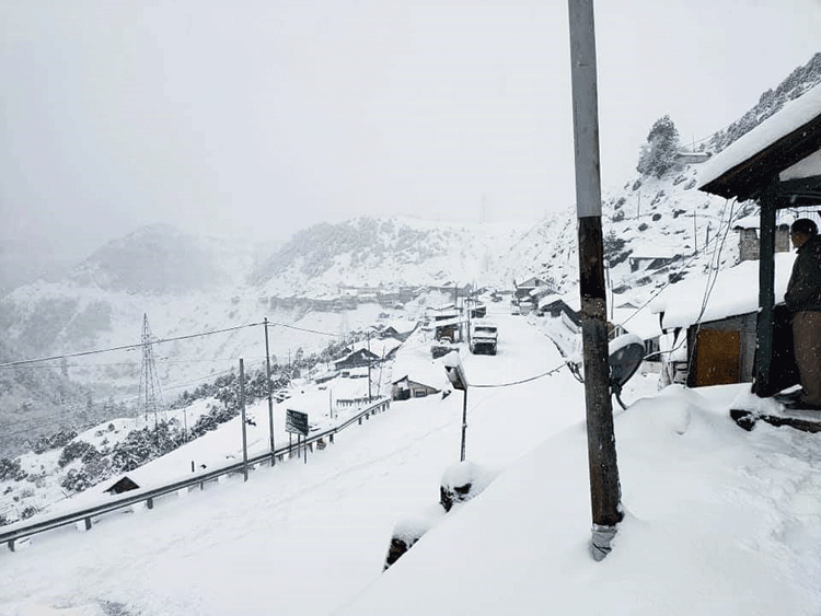 Vehicles make their way through milky Tsomgo in East Sikkim