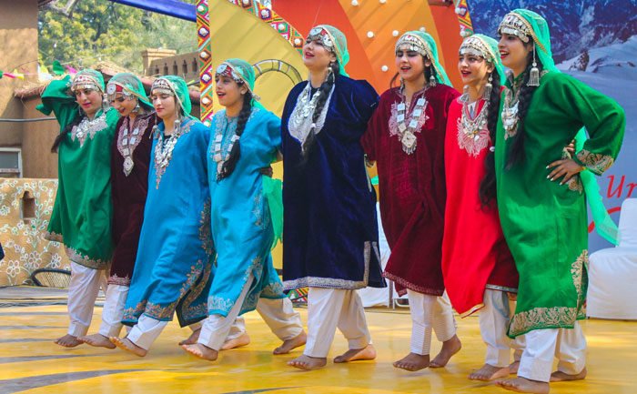 Folk artists from Jammu and Kashmir perform at the chaupal during the 34th International Surajkund Crafts Mela, in Faridabad