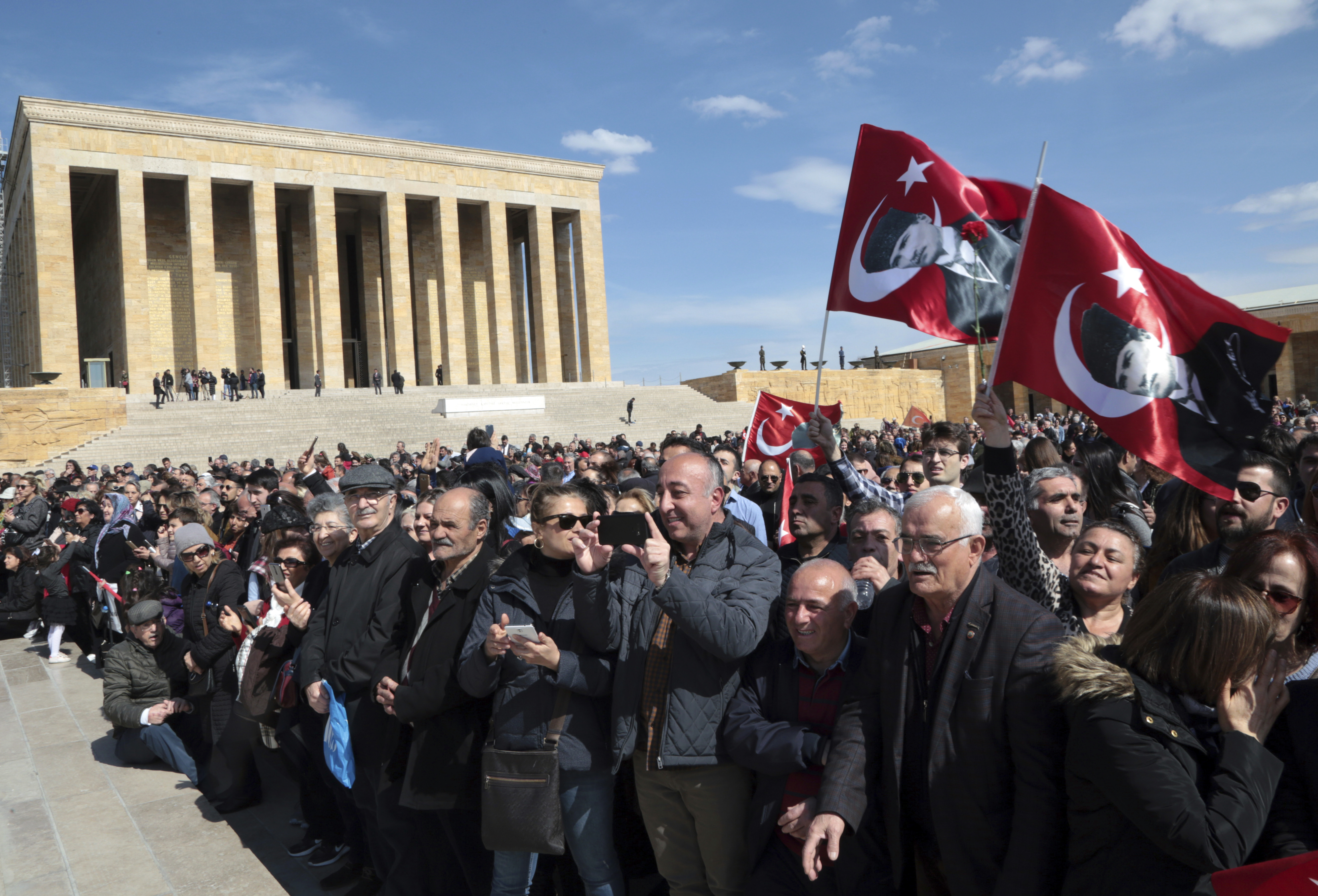 Thousands of supporters try to see Ekrem Imamoglu, the main Turkish opposition's candidate for Istanbul, as he visits the mausoleum of Mustafa Kemal Ataturk, in Ankara, Turkey, Tuesday, April 2, 2019.