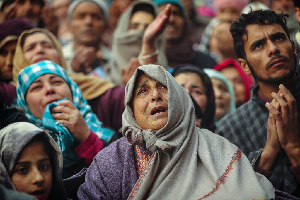 Kashmiri Muslim devotees offer prayer outside the shrine of Sufi saint Sheikh Syed Abdul Qadir Jeelani in Srinagar, December 9, 2019. Hundreds of devotees gathered at the shrine for the 11-day festival that marks the death anniversary of the Sufi saint. The image is part of the photo series that won the 2020 Pulitzer Prize for Feature Photography.