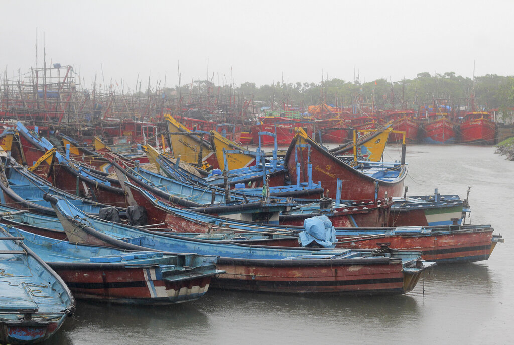 Boats are anchored at a fishing harbor at Paradeep, on the Bay of Bengal coast in Orissa, Tuesday, May 19, 2020. Cyclone Amphan was moving toward India and Bangladesh on Tuesday as authorities tried to evacuate millions of people while maintaining social distancing. 