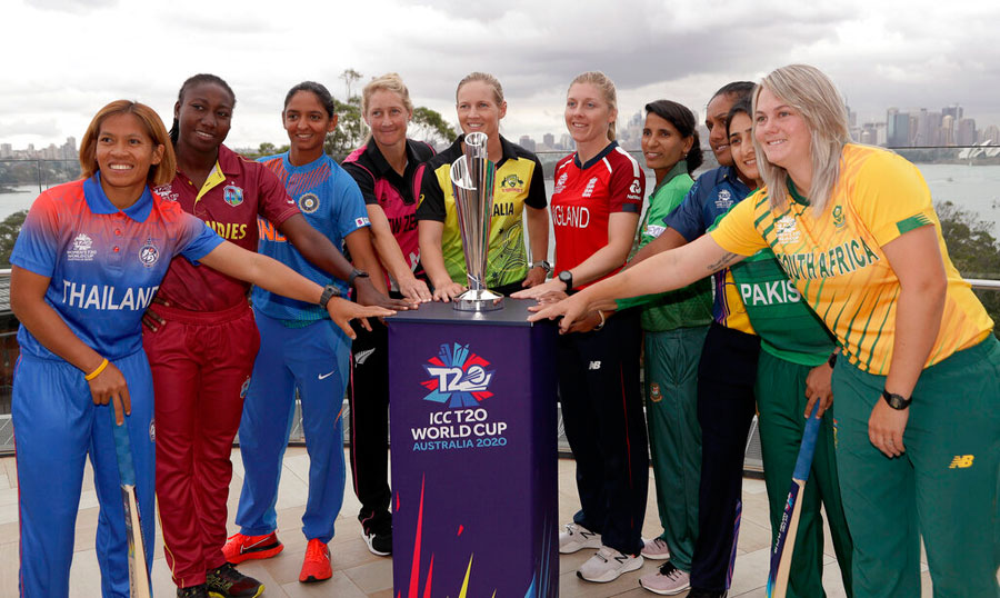 The captains of the 10 countries participating in the Women's T20 World Cup pose fore a photo with the trophy in Sydney on Monday
