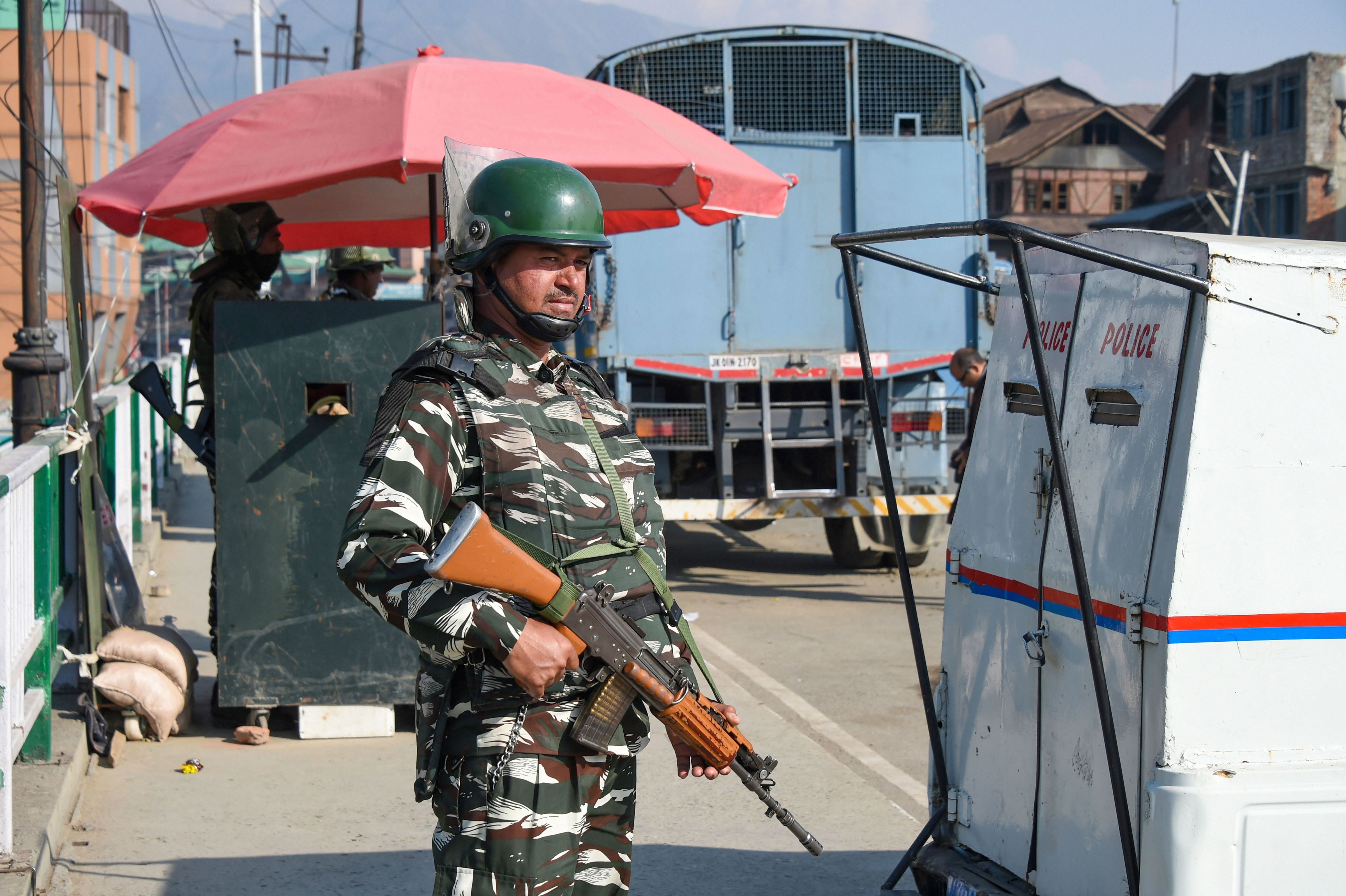 A security personnel stands guard during shutdown in Srinagar, Friday, October 25, 2019.
