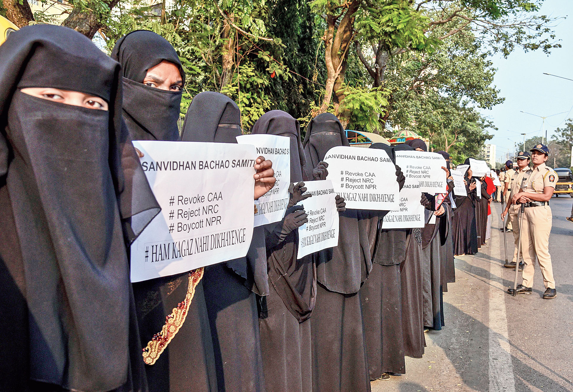 Protesters form a human chain from Malwani to Charkop as part of a demonstration against the Citizenship (Amendment) Act and National Register of Citizens in Mumbai on Sunday.