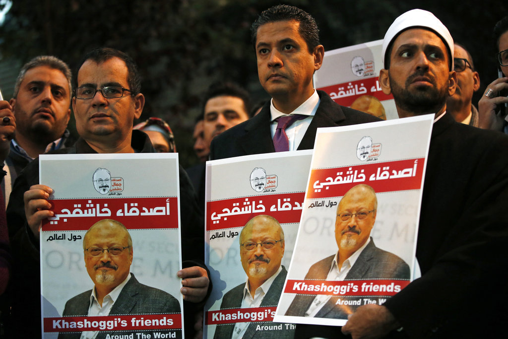 Activists protesting the killing of Saudi journalist Jamal Khashoggi hold a candlelight vigil outside Saudi Arabia's consulate in Istanbul