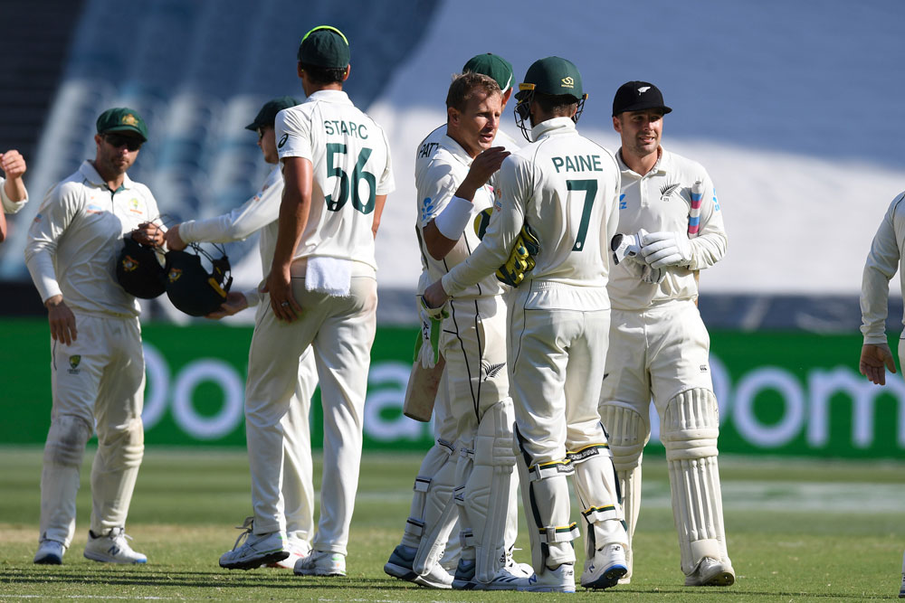 New Zealand and Australian players shake hands after the cricket test match in Melbourne, Australia on Sunday