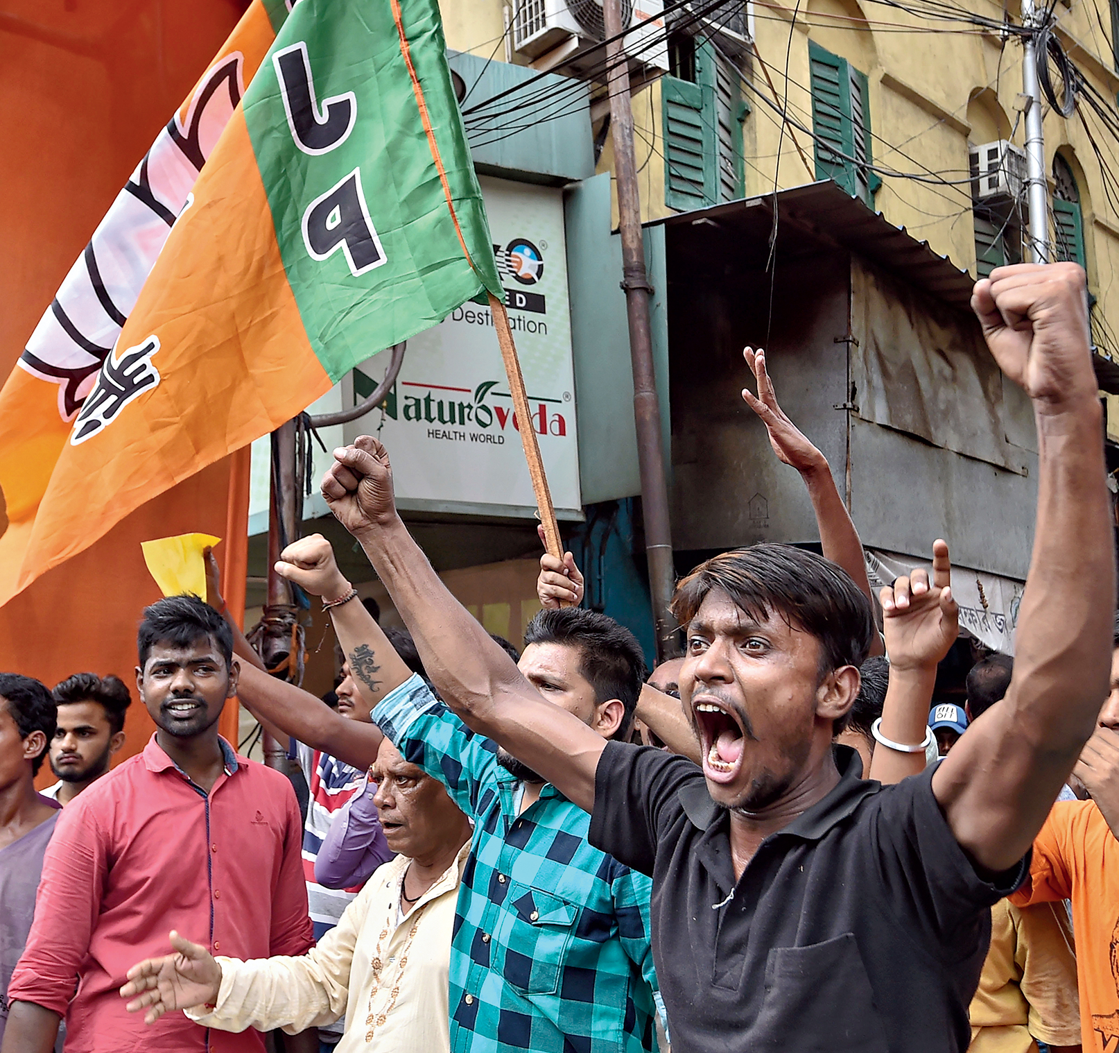 BJP supporters shout slogans during a protest in Calcutta on Sunday after the political murders in Sandeshkhali.