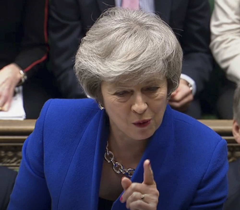 Britain's Prime Minister Theresa May speaks during Prime Minister's Questions in the House of Commons in London on Wednesday January 16, 2019. The House of Commons voted 325 to 306 to reject an opposition motion of no confidence against May's government