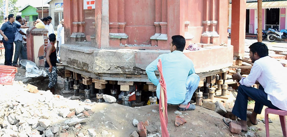 Workers wait at the site