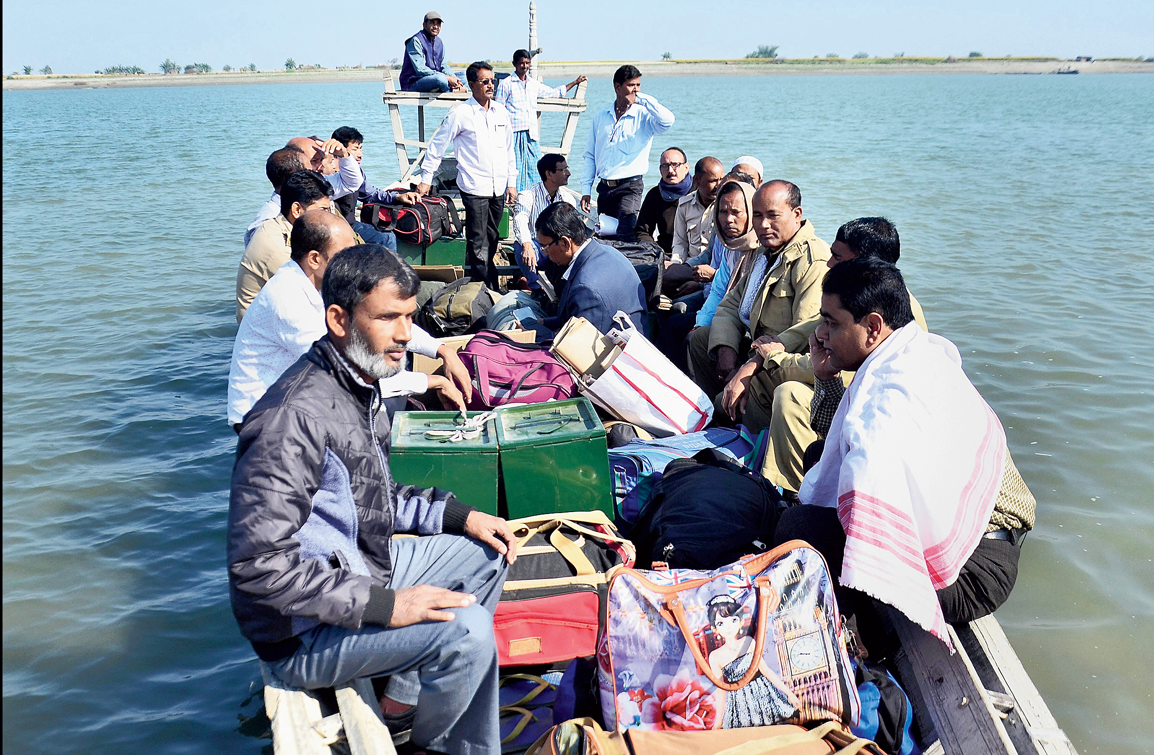 Poll officials leave by boat from Goroimari in Kamrup on Tuesday, the eve of the first phase of panchayat elections. 