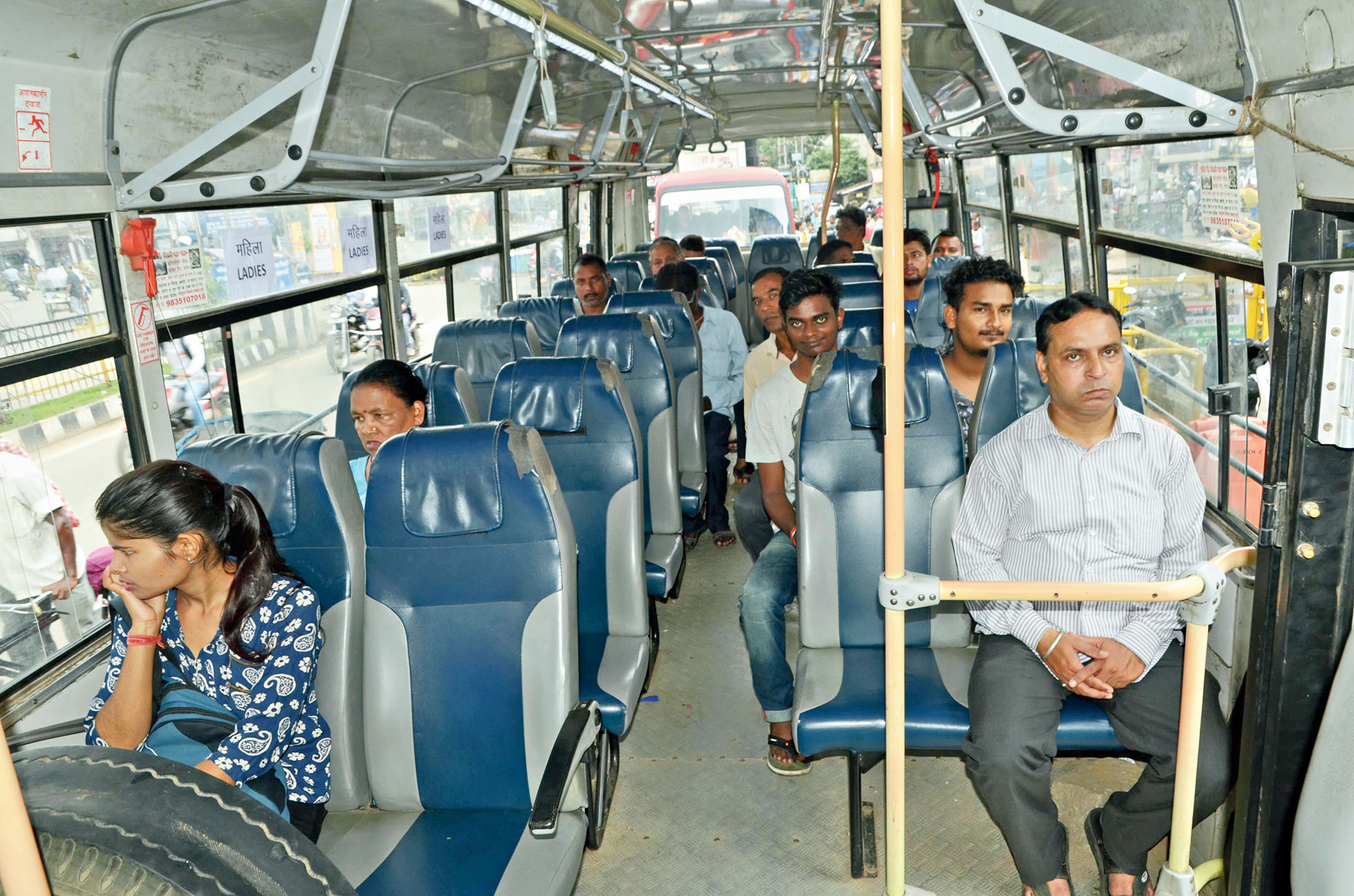 Passengers inside a city bus on Main Road in Ranchi on Monday. 
