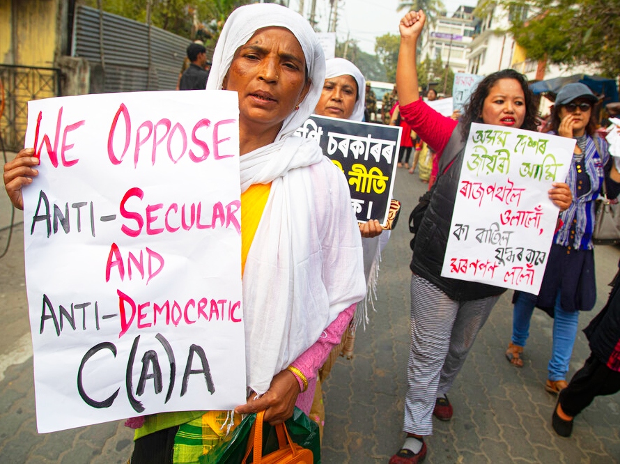 Women walk in a procession against the Citizenship (Amendment) Act in Guwahati on Sunday