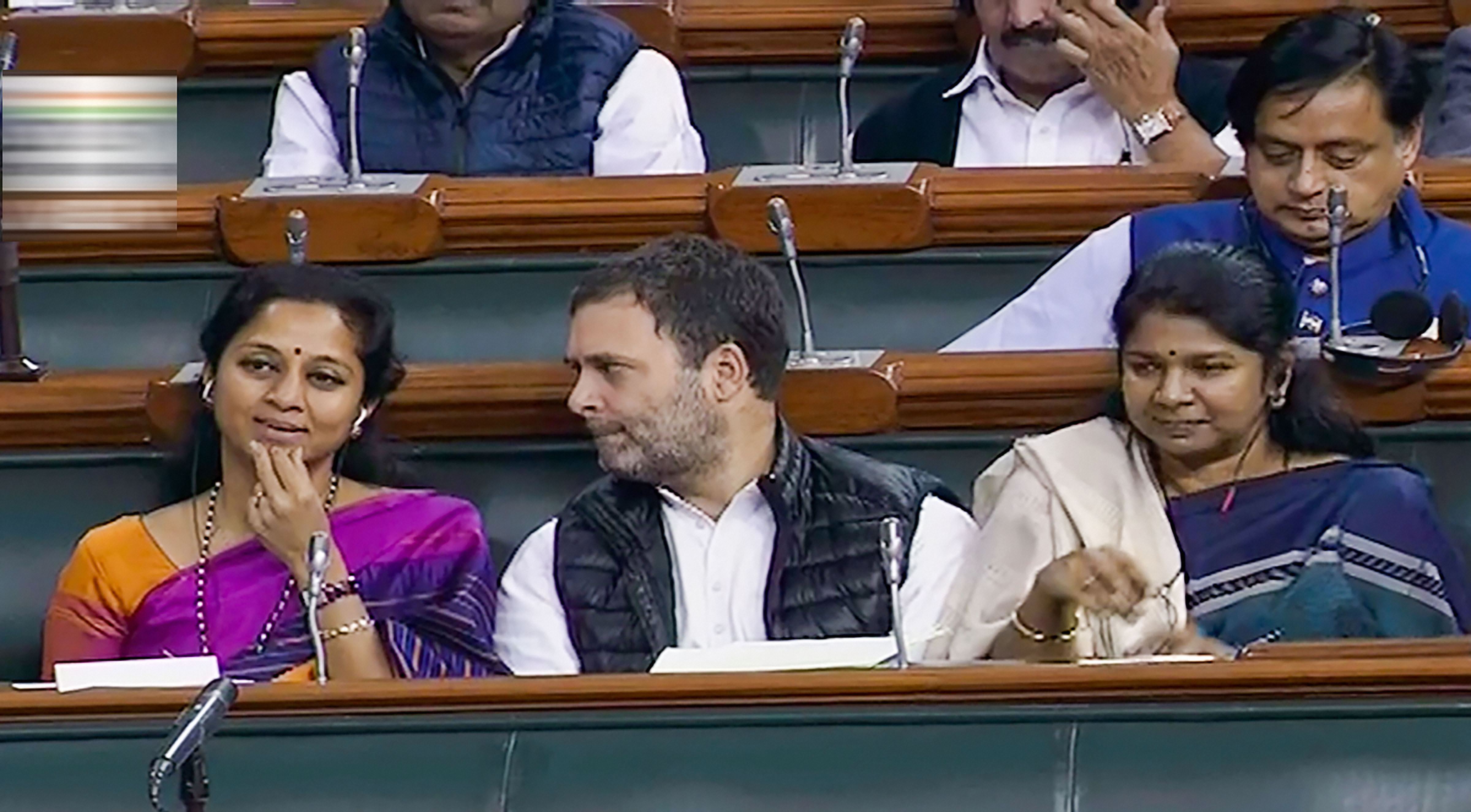 Congress MP Rahul Gandhi with NCP MP Supriya Sule (L) and DMKs Kanimozhi (R) in the Lok Sabha, during the ongoing Budget Session of Parliament, in New Delhi, Wednesday, February  5, 2020.