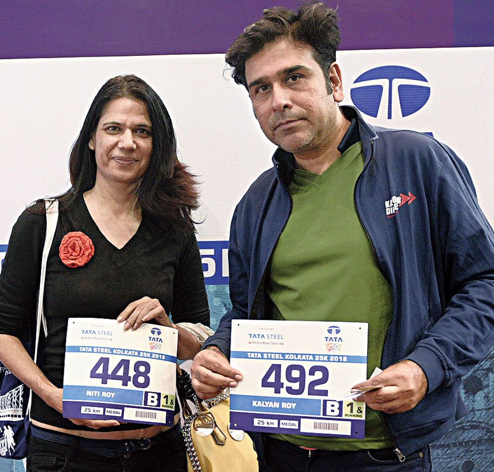 Kalyan and Niti Roy from Mumbai with their bibs. They will run the 25K