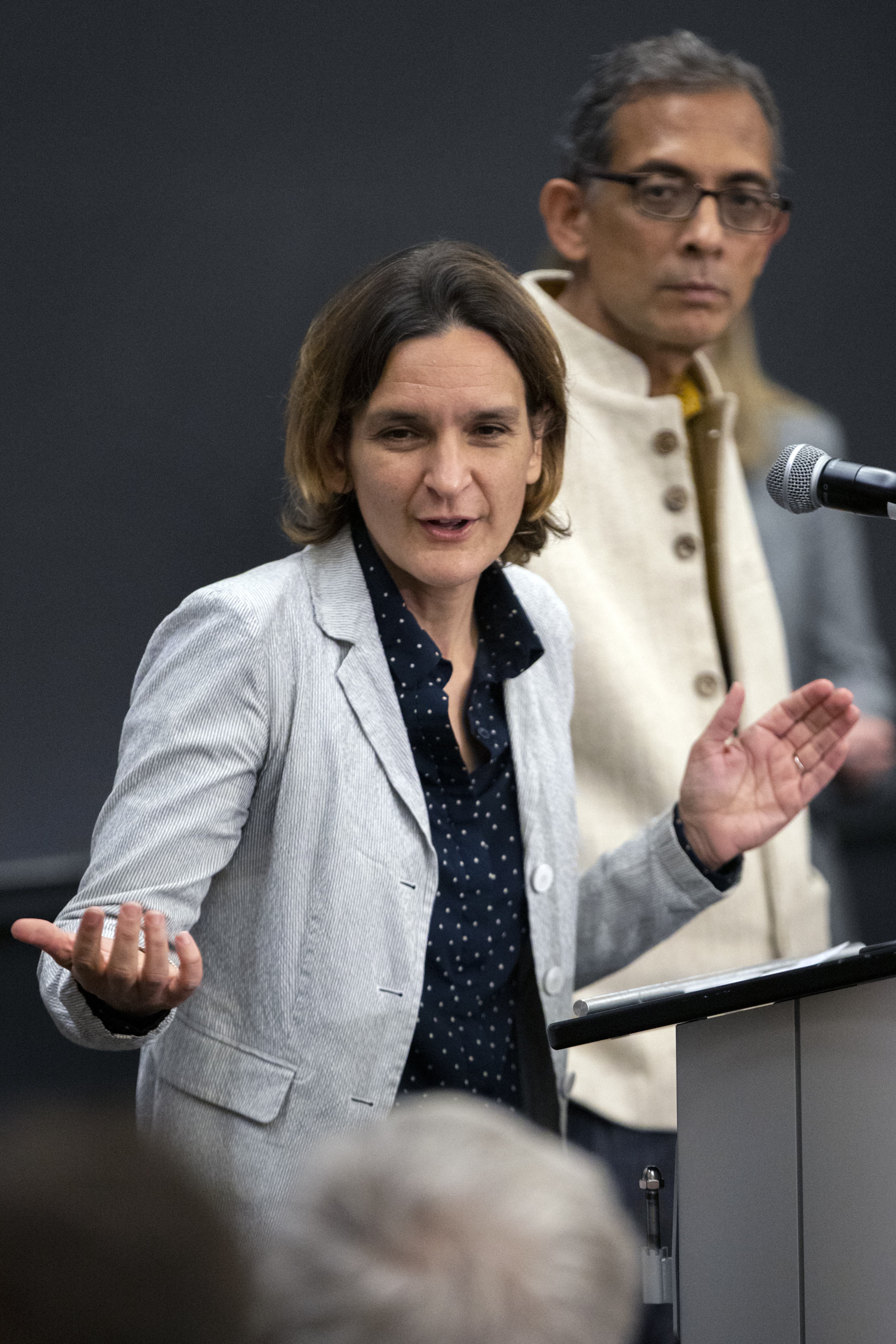 Esther Duflo, left, and Abhijit Banerjee speak during a news conference at Massachusetts Institute of Technology in Cambridge, Mass., Monday, October 14, 2019