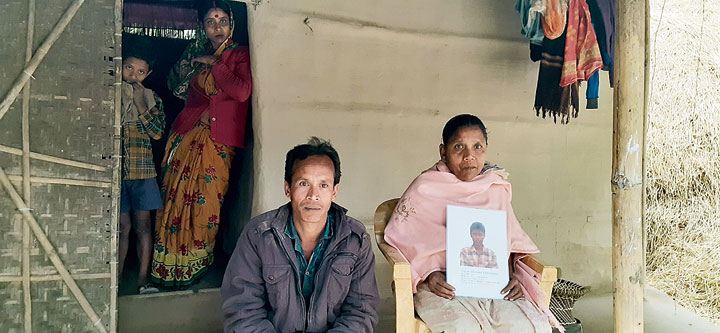 Probasi Namsudra with her son’s photo and elder son Subal