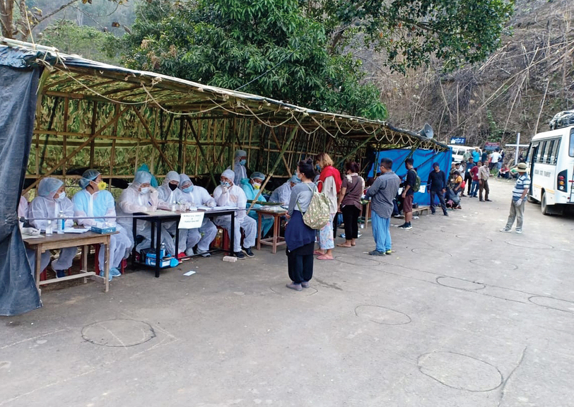 Stranded residents of Mizoram, who returned from Manipur, being screened at the border. 

