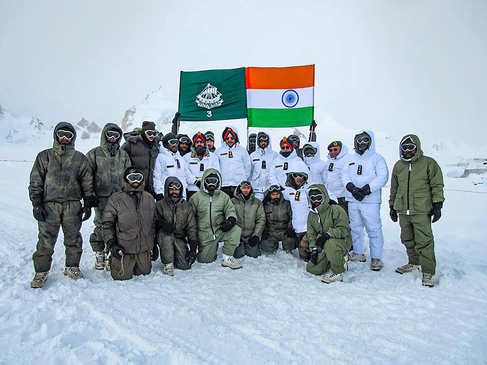 Lieutenant-general Ranbir Singh, General Officer Commanding-in-Chief, Northern Command, in a group photo with army personnel during a visit to the forward posts at Siachen on December 18