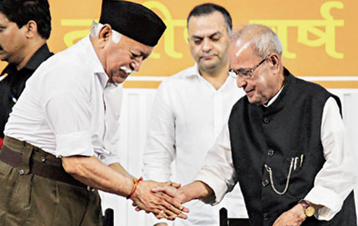 Pranab Mukherjee shakes hands with RSS chief Mohan Bhagwat in Nagpur in June last year. 