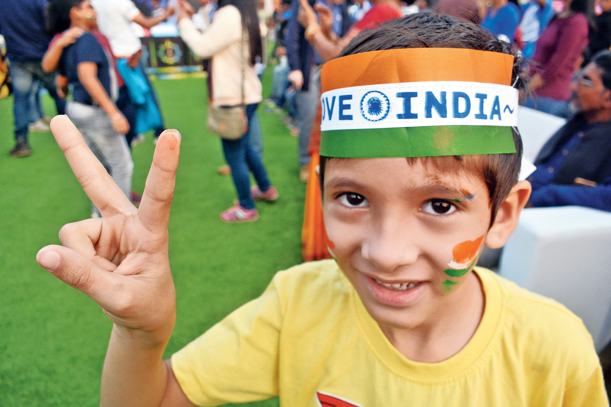 A hockey fan poses for the camera at Kalinga Stadium in Bhubaneswar on Saturday.