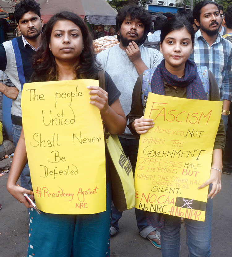 Mahima Ghosh, a student of Presidency University, and (right) Tanvi Das, a student of Scottish Church College at the protest