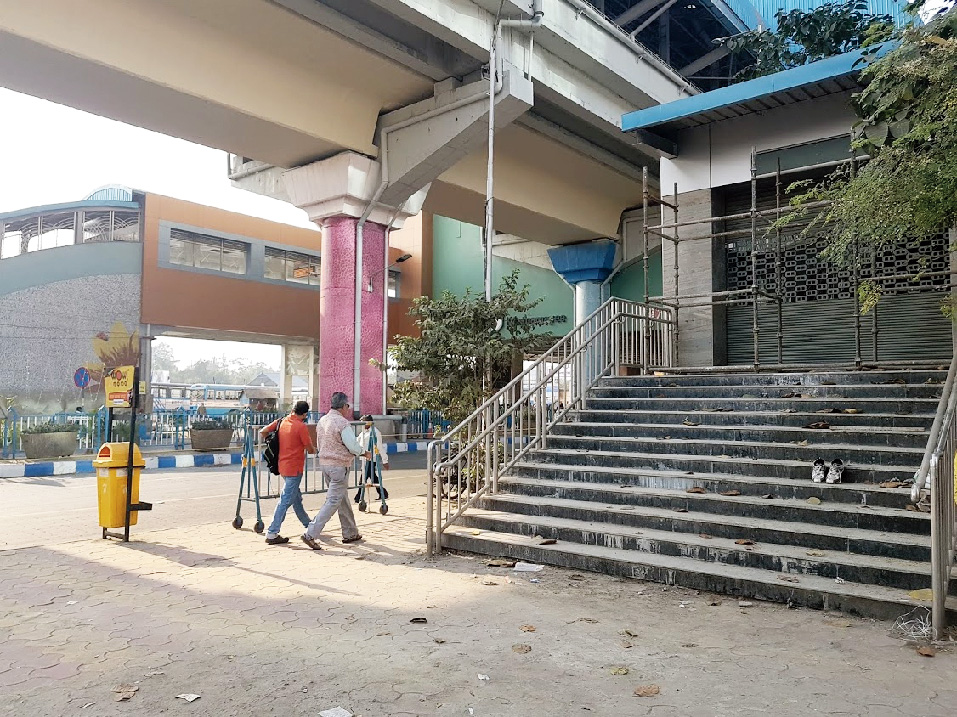 Shutters down at an overhead bridge entrance.
