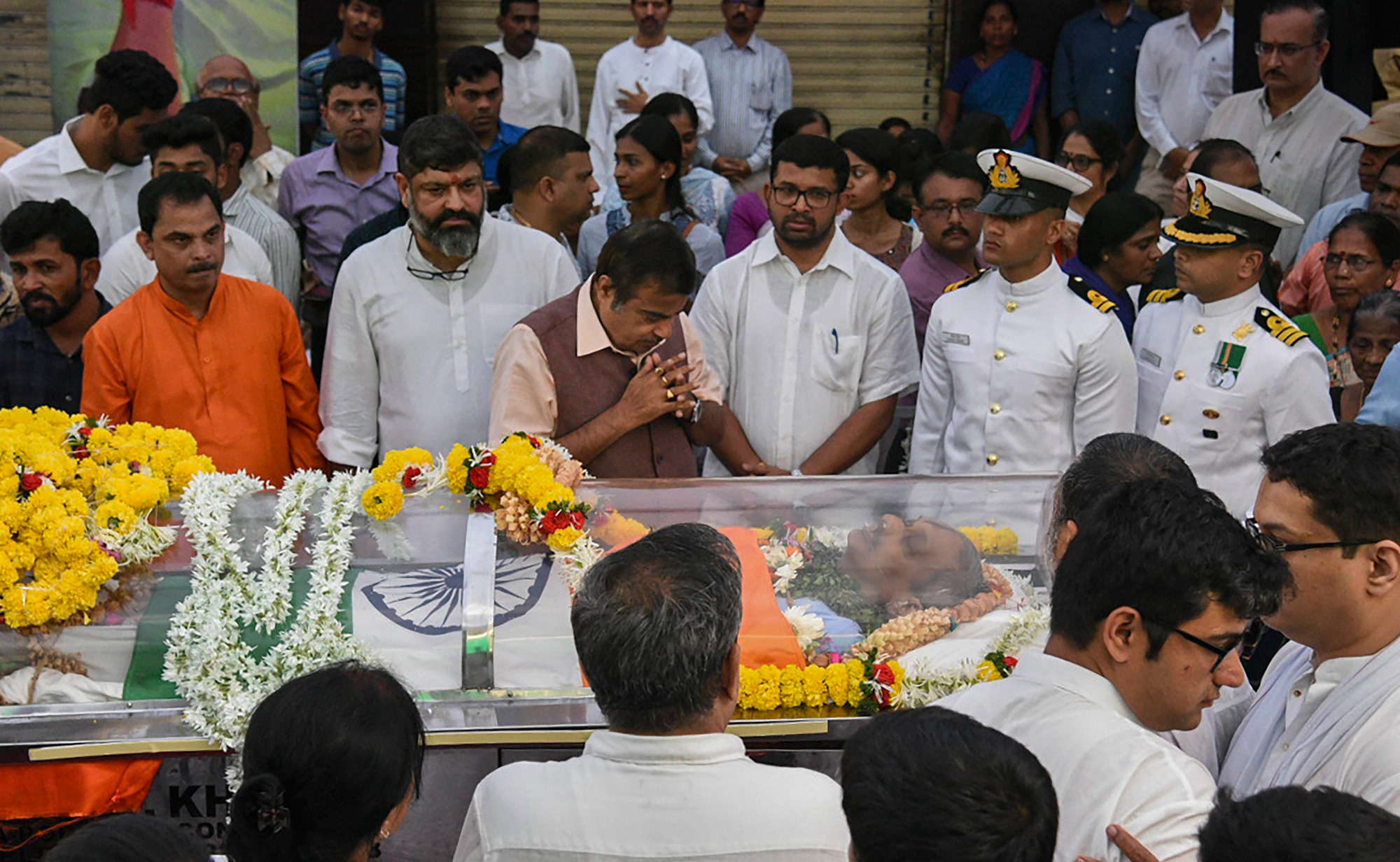 Union Transport Minister Nitin Gadkari pays homage to former Goa Chief Minister Manohar Parrikar, who passed away battling pancreatic ailment on Sunday, in Panaji on Monday, March 18, 2019.
