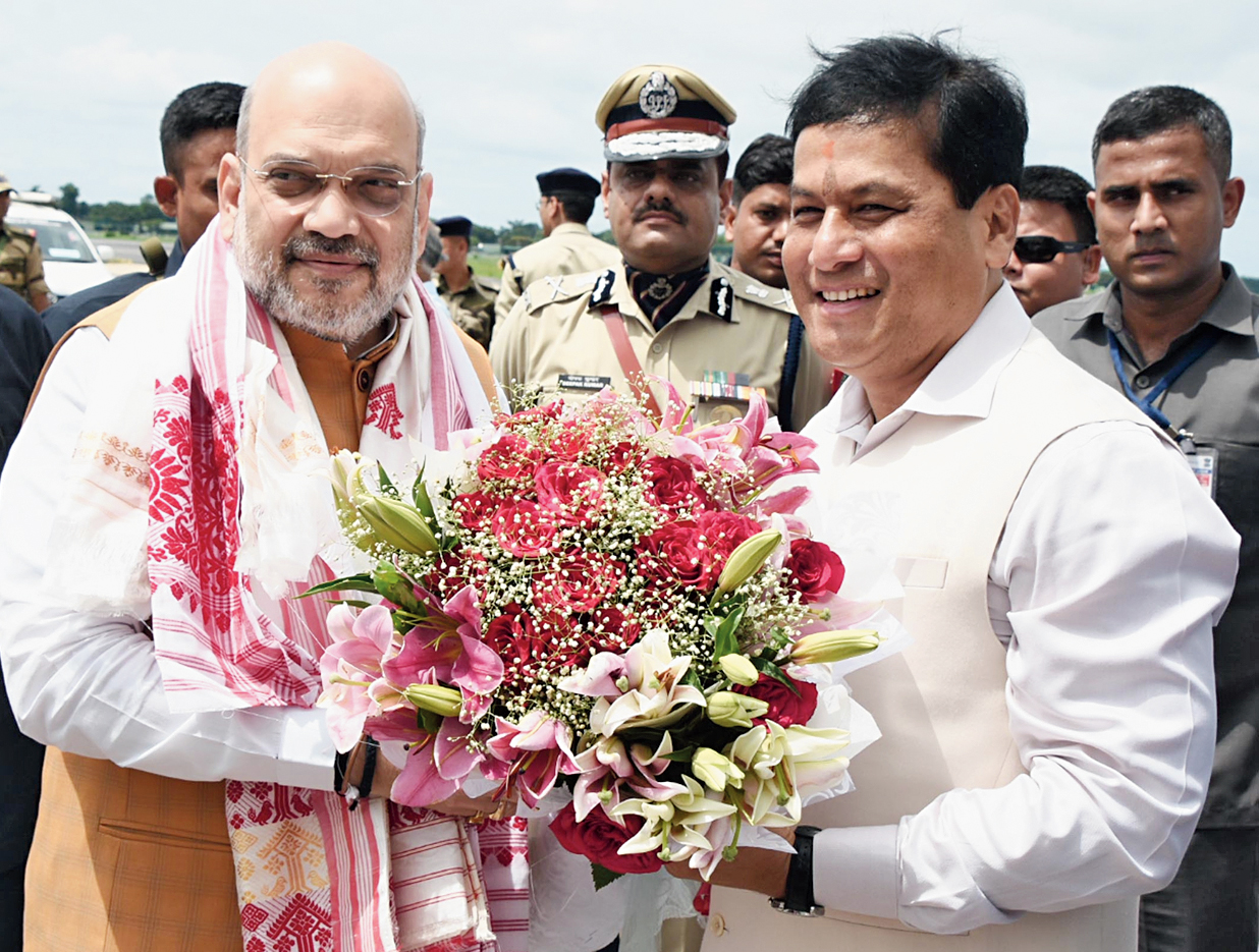 Assam chief minister Sarbananda Sonowal welcomes home minister Amit Shah on his arrival at LGBI Airport. 