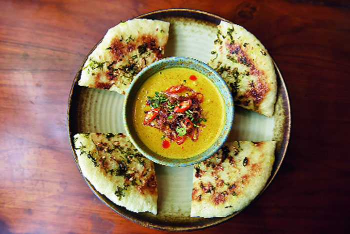 This Sweet Corn in Thai Yellow Curry is a vegetarian’s delight. This sumptuous Thai curry is topped with crunchy fried onions, chillies and fresh coriander leaves and comes with pan-fried bao buns that you can use to scoop up the curry. It is packed with flavours of curry powder, light soy and garlic while turmeric lends its yellow colour to the curry. The combination of the soft bao bun and bite of corn in the coconut milk curry is an explosion of flavour in your mouth.