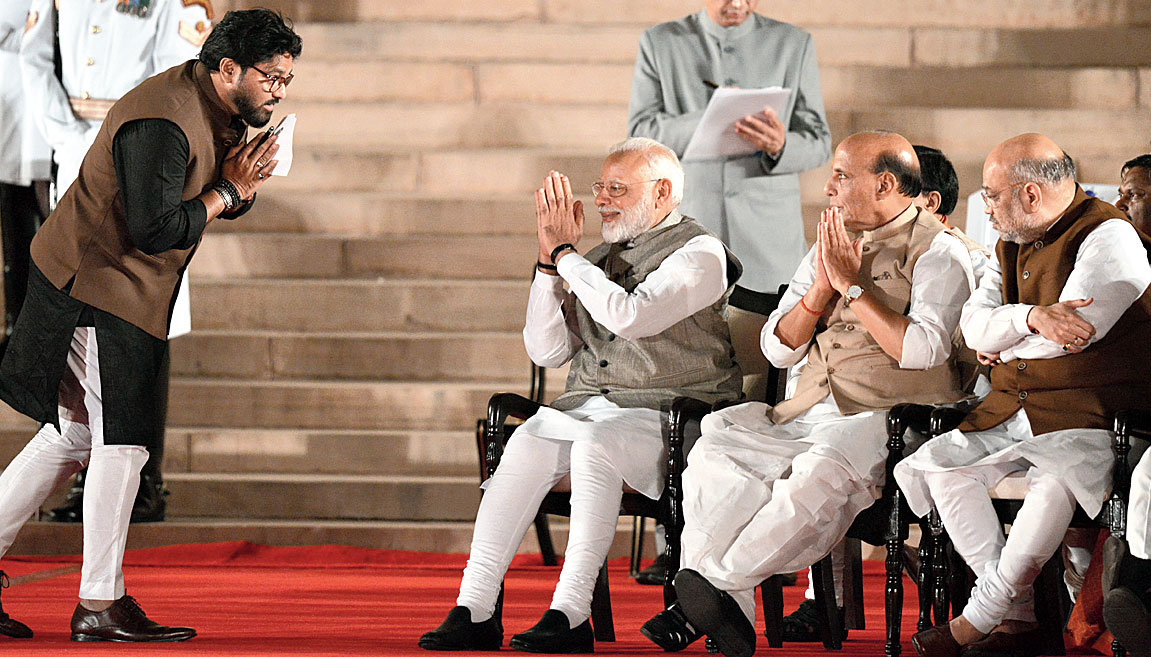 Babul Supriyo greets Modi and other BJP leaders after taking oath in Delhi on Thursday.