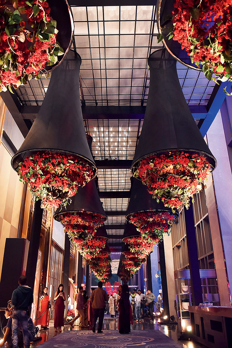 pre-function area: The ceiling had 40 stunning flower chandeliers — black cone-like structures with brilliant red flower spirals in them — hanging from it. “Local flowers were mostly used in the making of this year’s She Awards decor. The magnitude and boldness of the structures is the manifestation of a woman’s character. Still, it also has the love and beauty of a mother. This concept really befitted the decor for She Awards,” said Baisakhi.