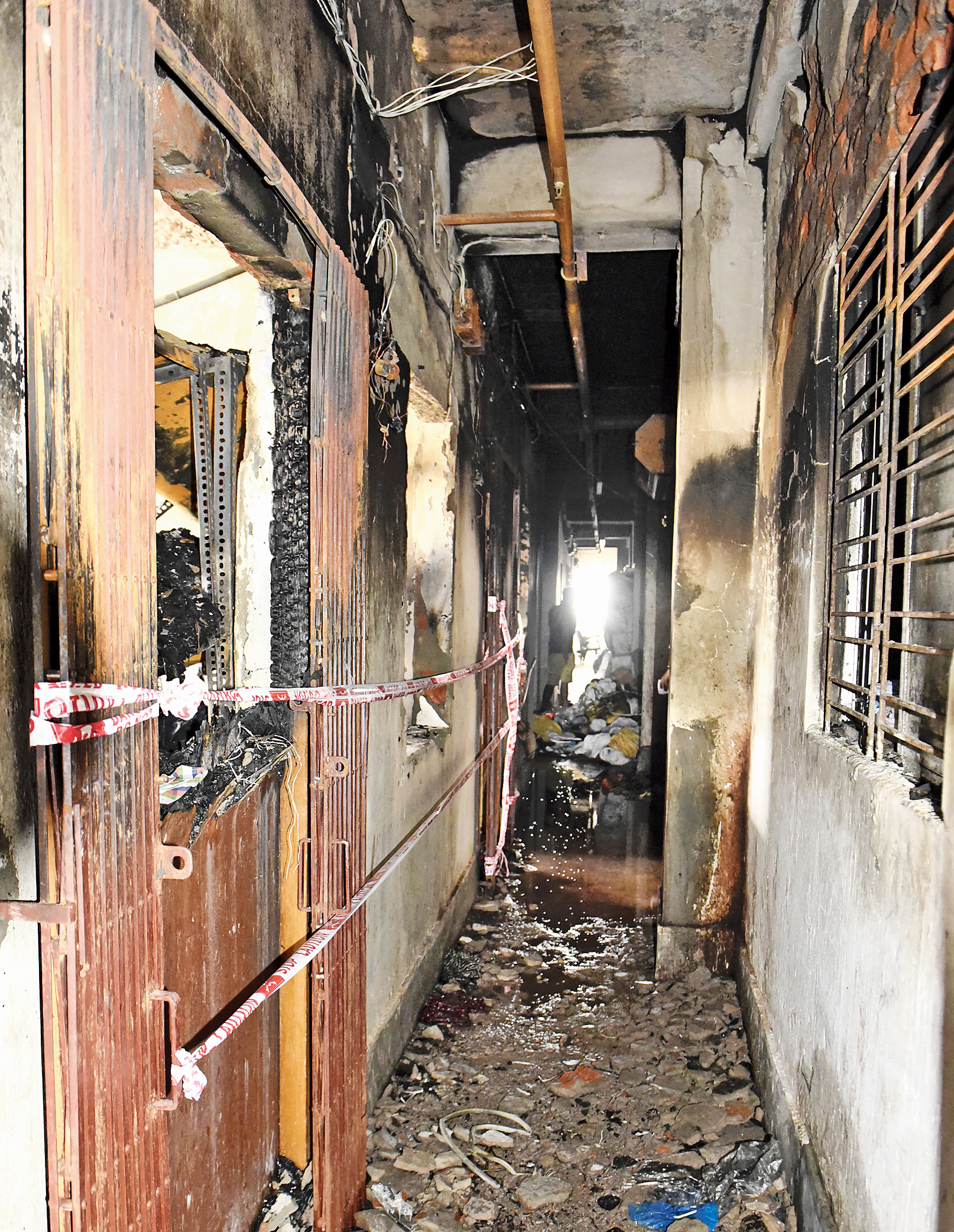 A fire-ravaged godown at Nandaram Market. 
