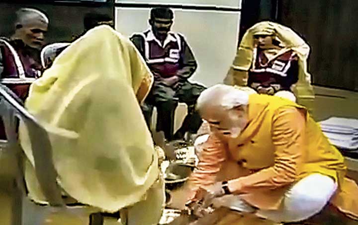 Footage shows Narendra Modi honouring the sanitation workers in Allahabad on Sunday.