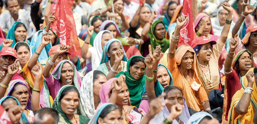 Tribals and farmers protest in Mumbai on Tuesday to demand loan waivers and transfer of land titles. 