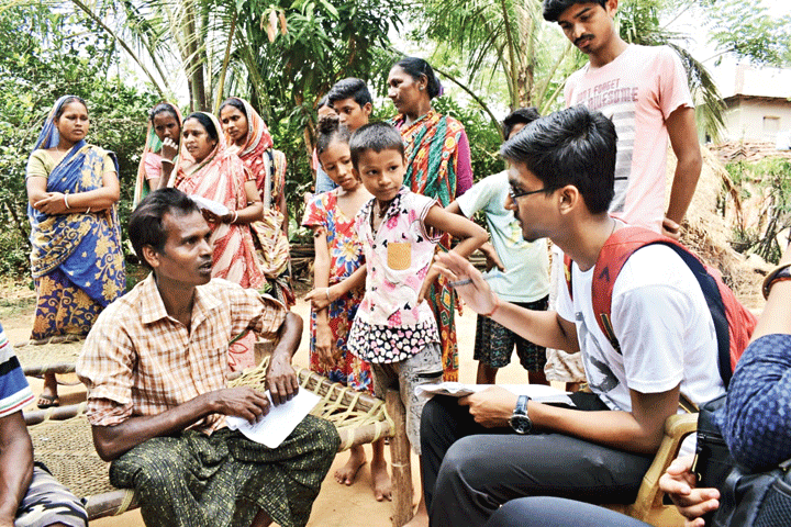 A student of IIT Kharagpur interacts with villagers

