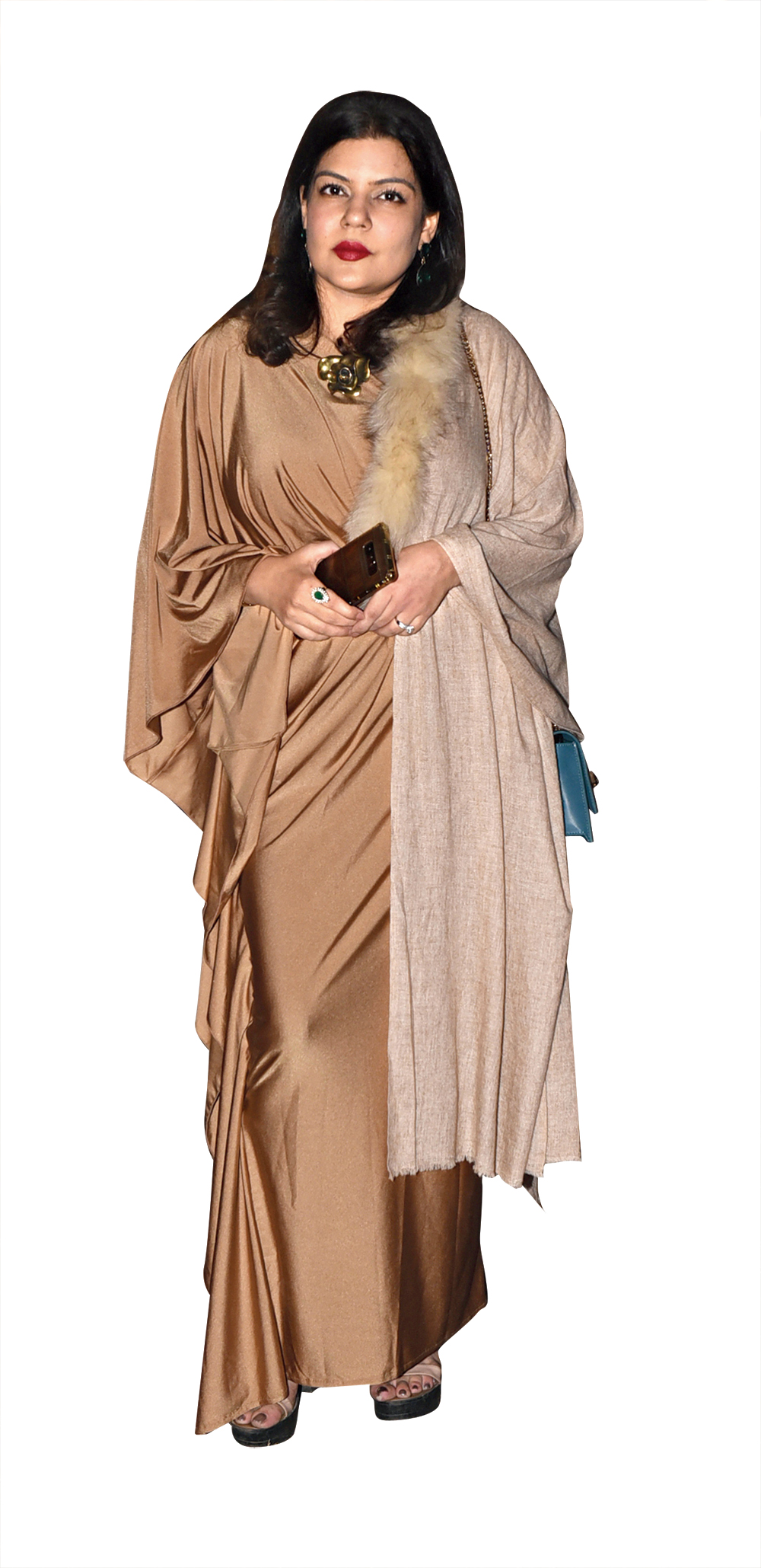 For Sharini Sharma, beige-on-beige was the call of the night as she teamed her slinky gown, “picked up from somewhere in Europe”, with a fur coat that was a gift from her sister. A chunky statement neckpiece and red lips completed her look perfectly.