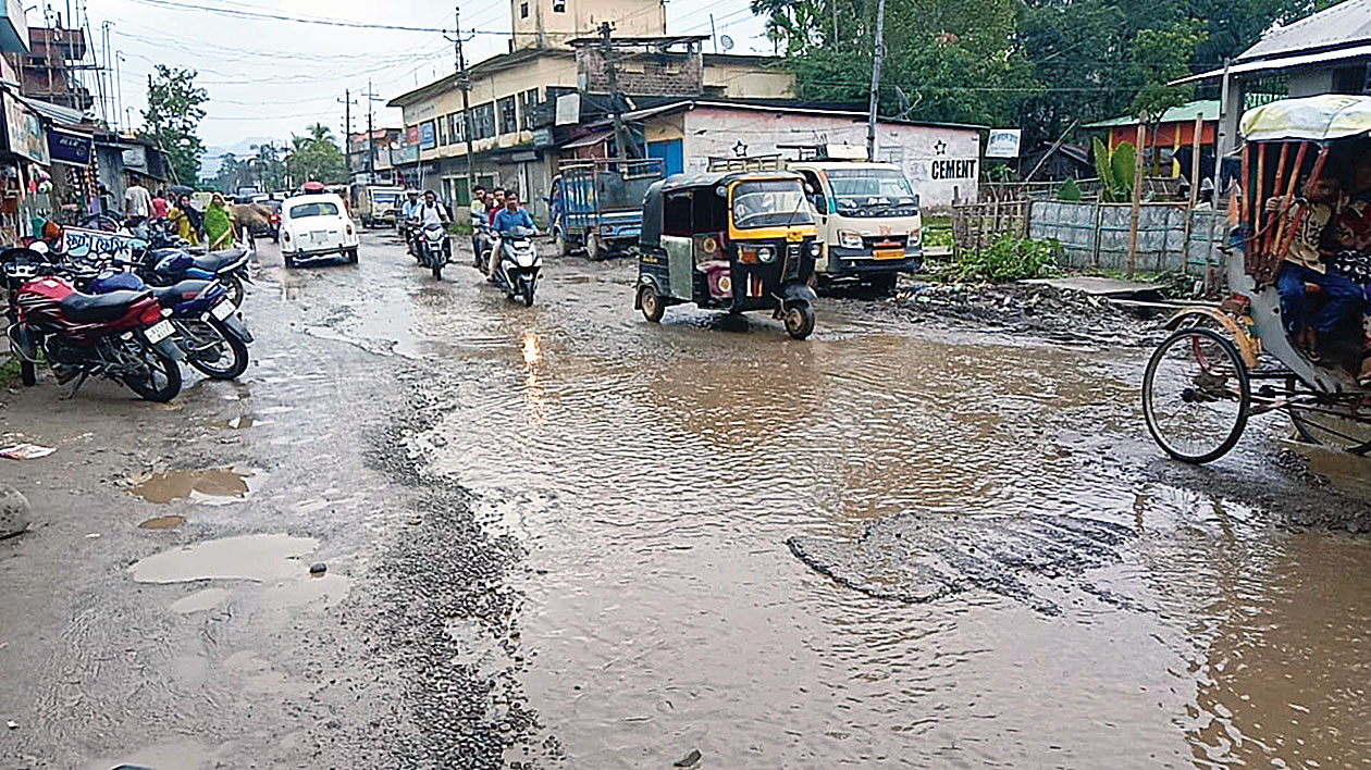 The pothole-filled VIP Road at Udharbond in Assam’s Cachar district. 