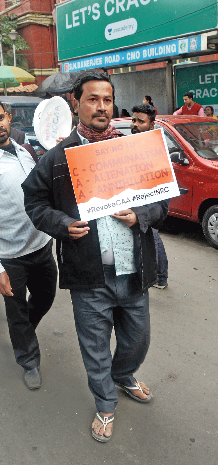 A man from Barasat carried a poster that read “C-Communalism, A-Alienation, A-Annihilation; say no to CAA”.