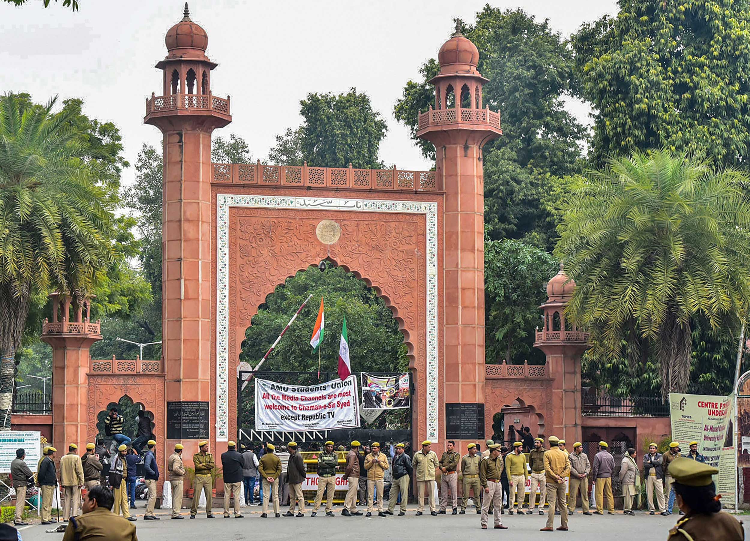 Police deployed on the campus of Aligarh Muslim University in the view of protests after students were booked on alleged sedition charges, in Aligarh, on Friday.