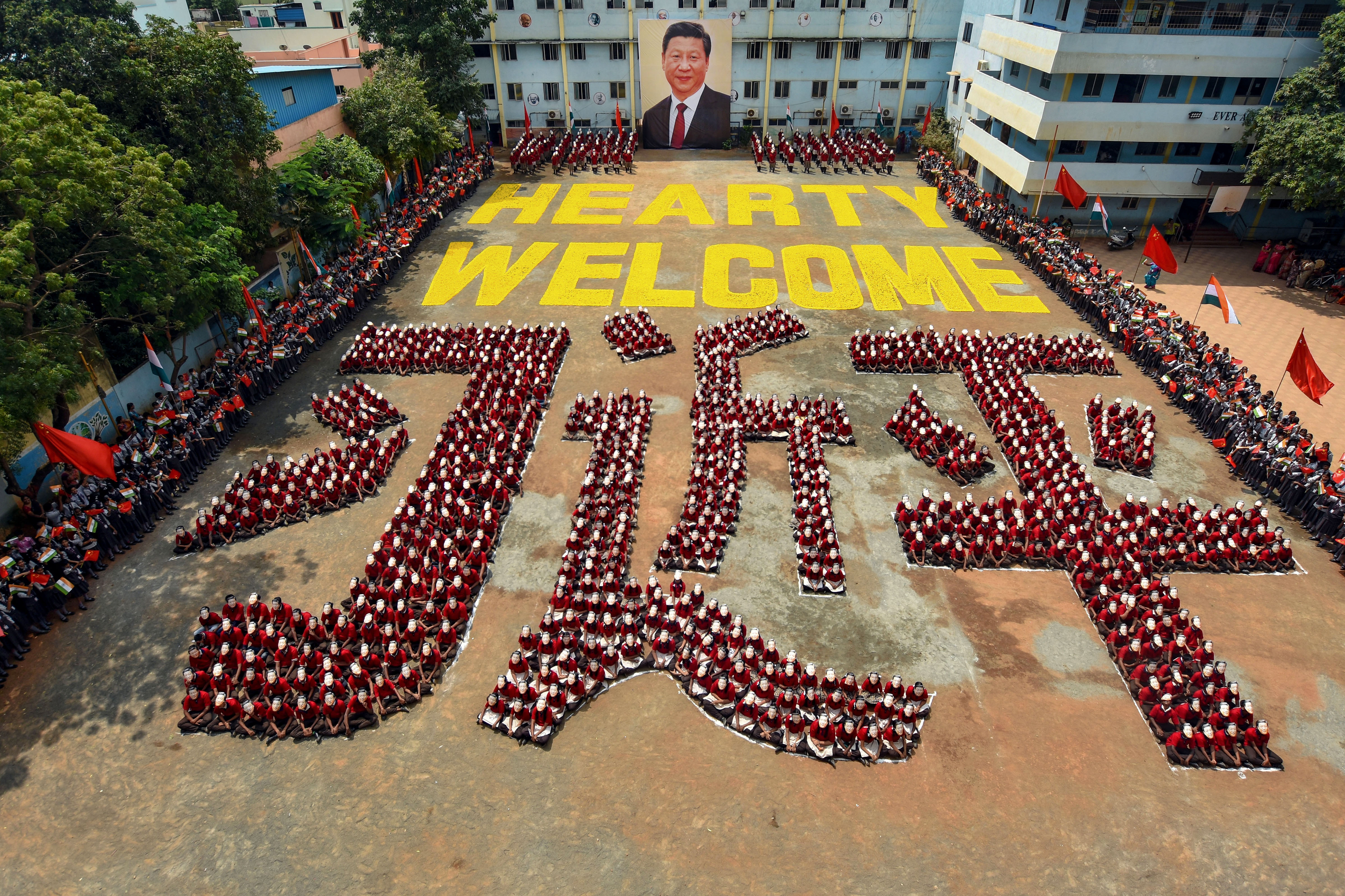 School students create a formation of Chinese President Xi Jinping’s name in Mandarin, ahead of his visit, in Chennai, Friday, October 10, 2019