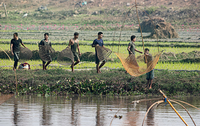 people head out with traditional tools for community fishing on Friday