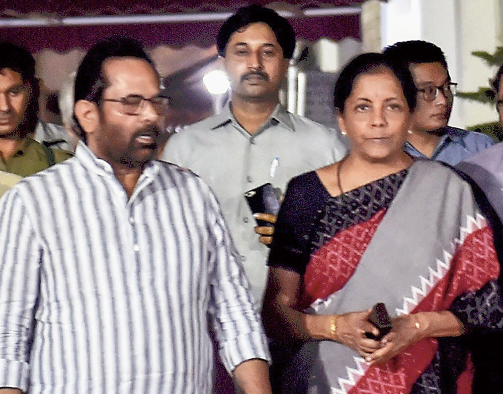 Naqvi and Nirmala leave after meeting the Election Commission officials in New Delhi on Tuesday. 
