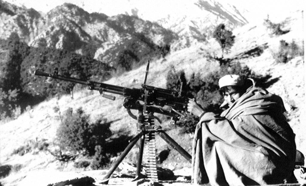 In this file photo taken on January 1, 1988, an Afghan rebel armed with an anti-aircraft machine gun gets ready to fire at position in the Nangarhar province of Afghanistan. As Russia prepares to mark Friday's anniversary of the Soviet withdrawal, many see the 10-year Soviet war in Afghanistan as a necessary and largely successful endeavour.