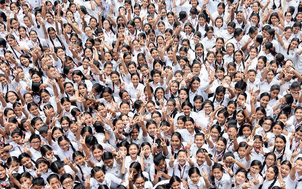 Students of St Mary’s HS School in Guwahati on Wednesday celebrate the institution’s success in the HSLC examination
