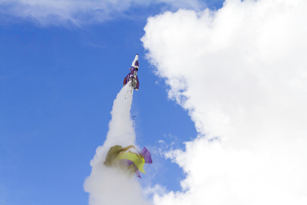 In this Saturday afternoon, February 22, 2020, photo "Mad" Mike Hughes rocket takes off, with what appears to be a parachute tearing off during its launch near Barstow, Calif. Hughes, a California man who said he wanted to fly to the edge of outer space to see if the world is flat or round has died after his home-built rocket blasted off into the desert sky and plunged back to earth. "Mad" Mike Hughes, 64, was killed on Saturday after his rocket crashed.