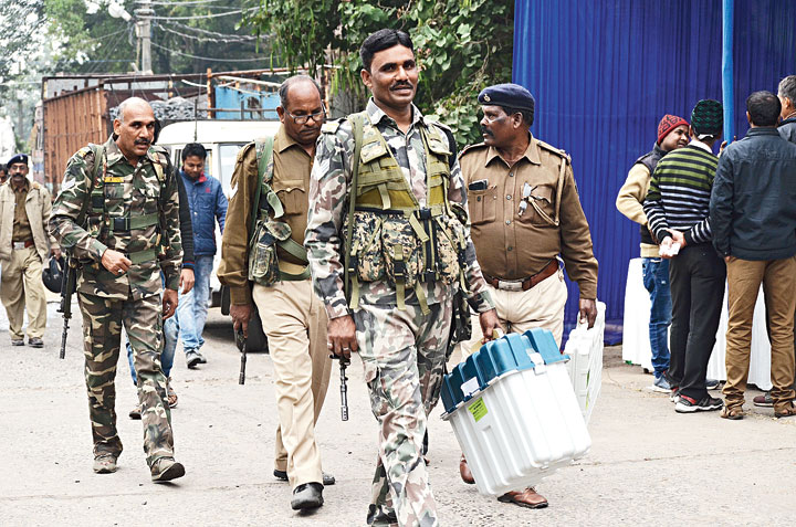 Armed forces leave for polling booths in Dhanbad on Sunday. 