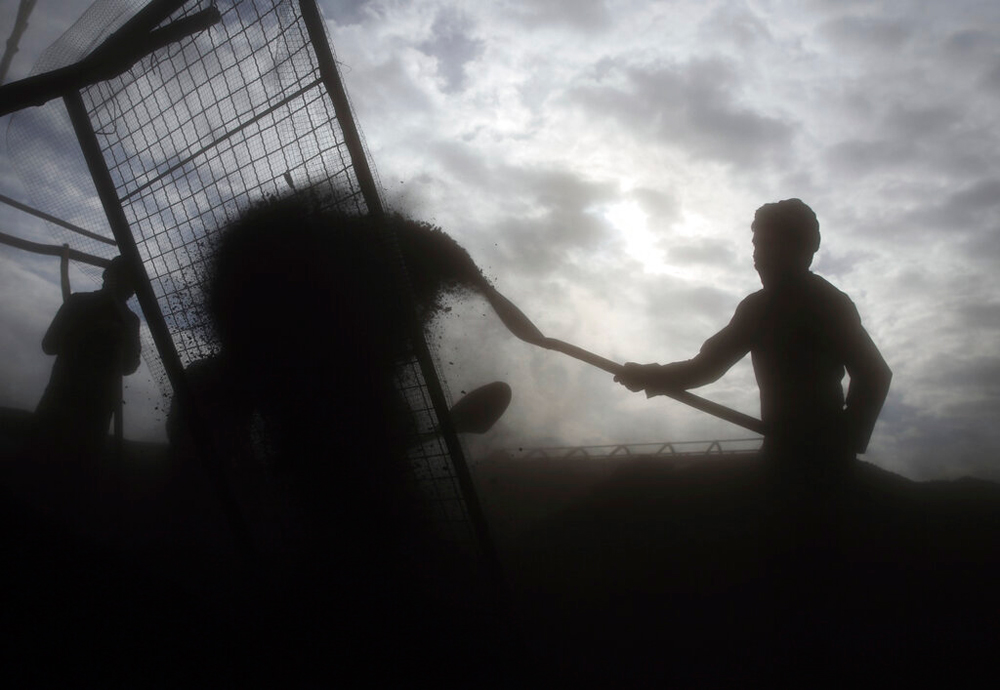 Labourers at a charcoal market on the outskirts of Kabul on December 18
