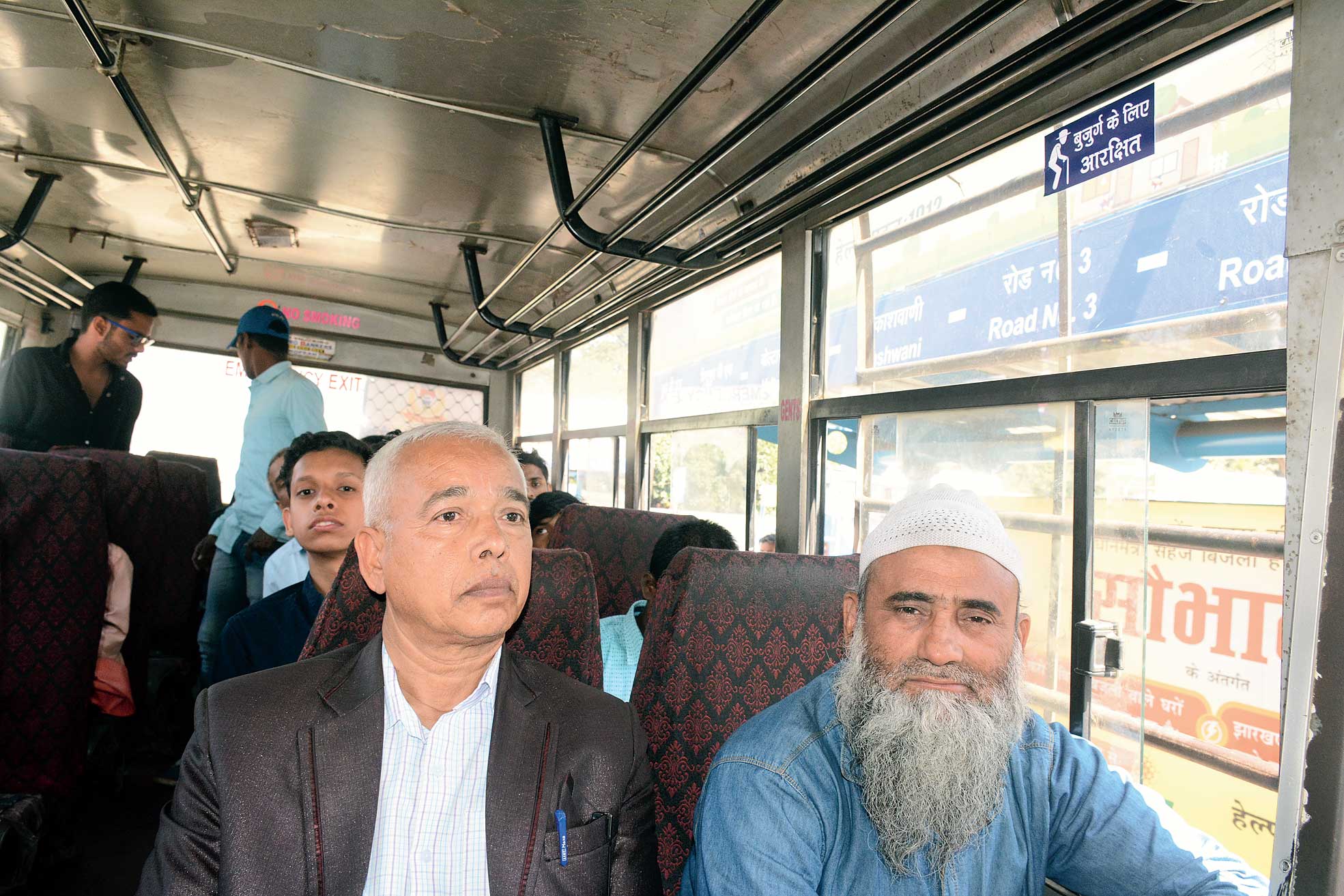 Elderly passengers ride a town bus in Sakchi, Jamshedpur, on Tuesday. 
